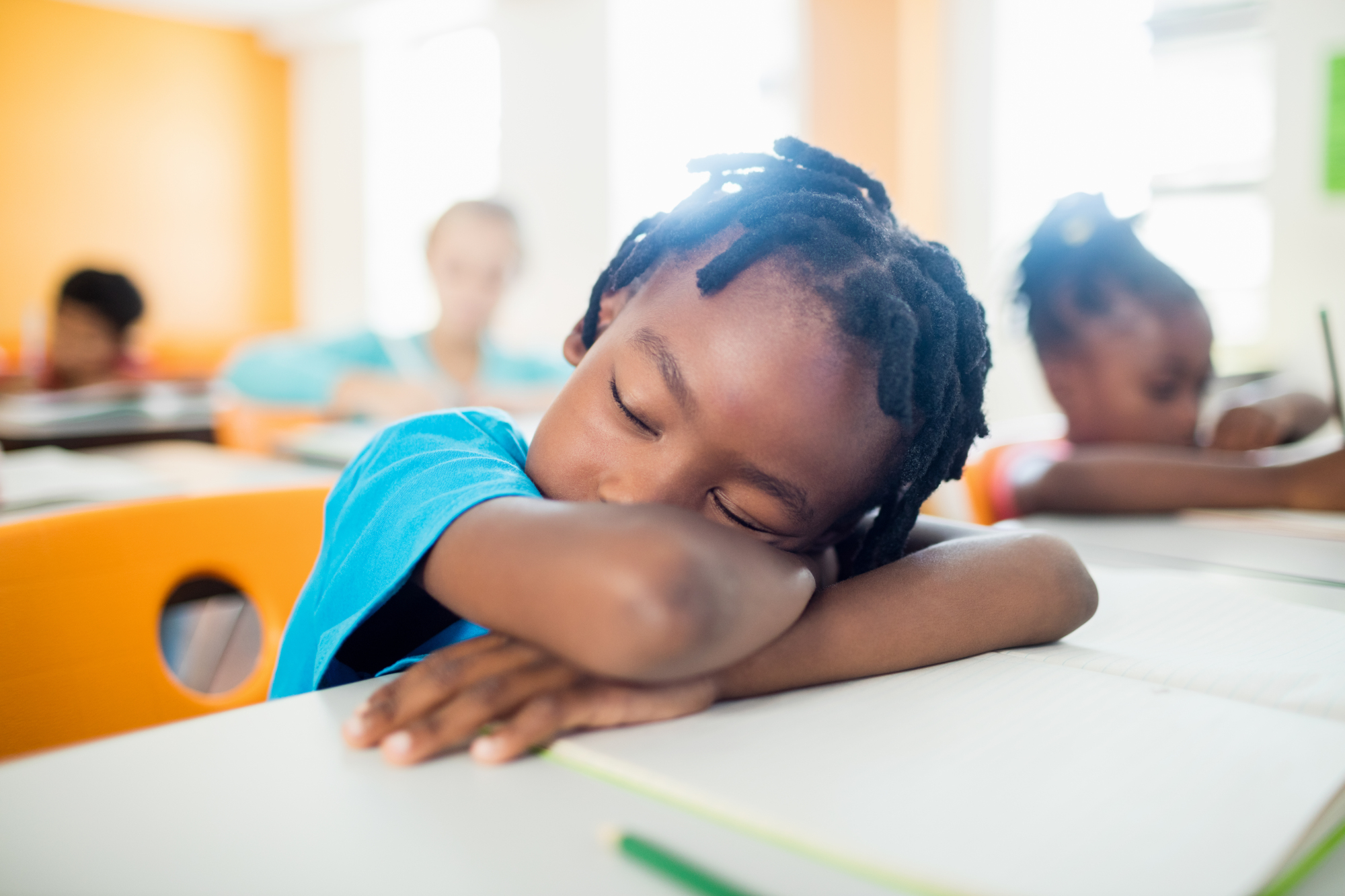 Pupil.Falling.Asleep.At.His.Desk.In.Classroom