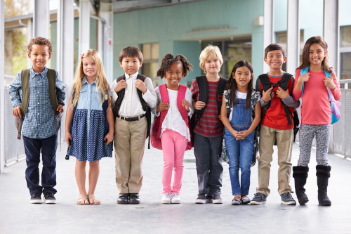 Group,Of,Elementary,School,Kids,Standing,In,School,Corridor