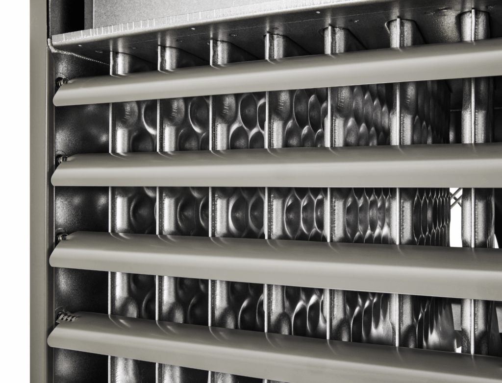 Front detail view of a Modine gas-fired power-vented unit heater, model PDP, showcasing a magnified view of the directional deflector blades and the classic clam shell heat exchanger inside the unit's housing